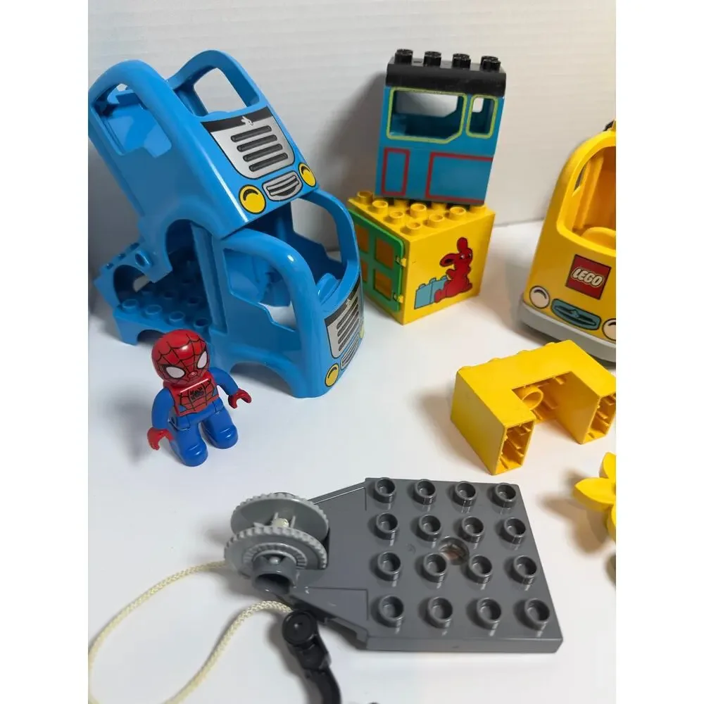 Lot of 21 Lego duplo pieces incl Spiderman figure and police officer accessories